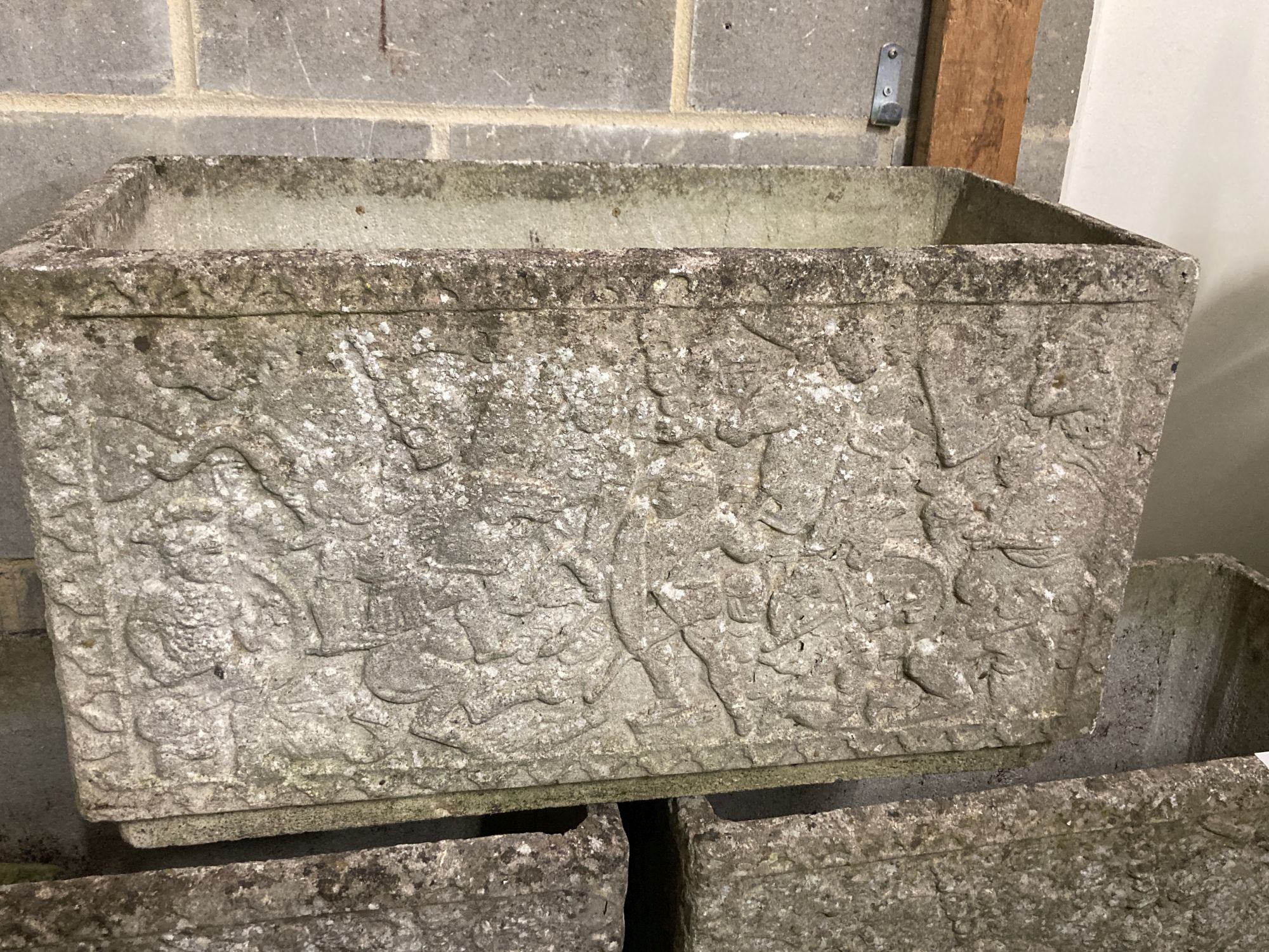 A set of three reconstituted stone rectangular garden planters with claw feet, width 77cm, depth 39cm, height 44cm